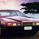 A photo of a purple Aston Martin Lagonda saloon